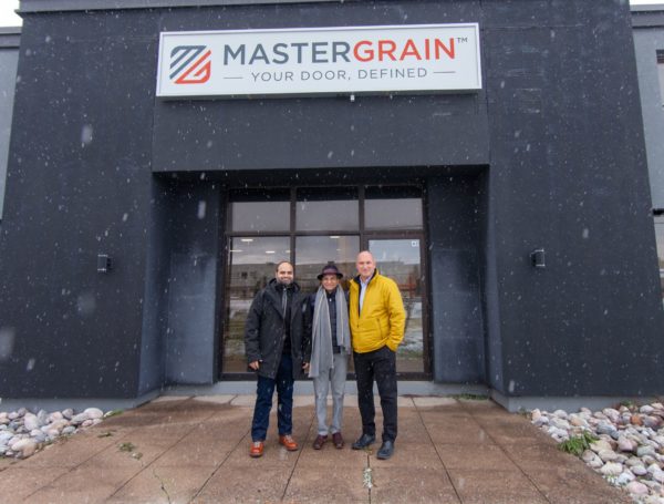 Iqbal Kassam, Nabil Kassam and Chris Edwards in front of the MASTERGRAIN Manufacturing facility in Midland