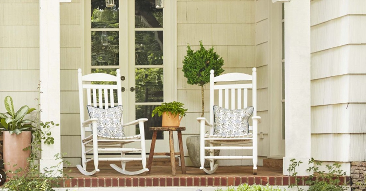 White painted rocking chairs on porch